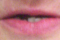 Close-up of natural pink lips showing healthy lip condition and appearance.