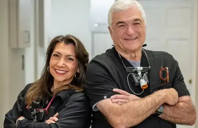 Two dental professionals smiling at Sun City West dental practice in Arizona.
