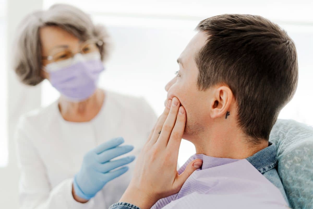 Patient discussing dental crown treatment with dentist in Sun City West, AZ.